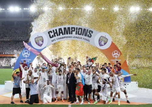 Al Ain lifting the AFC Champions League trophy