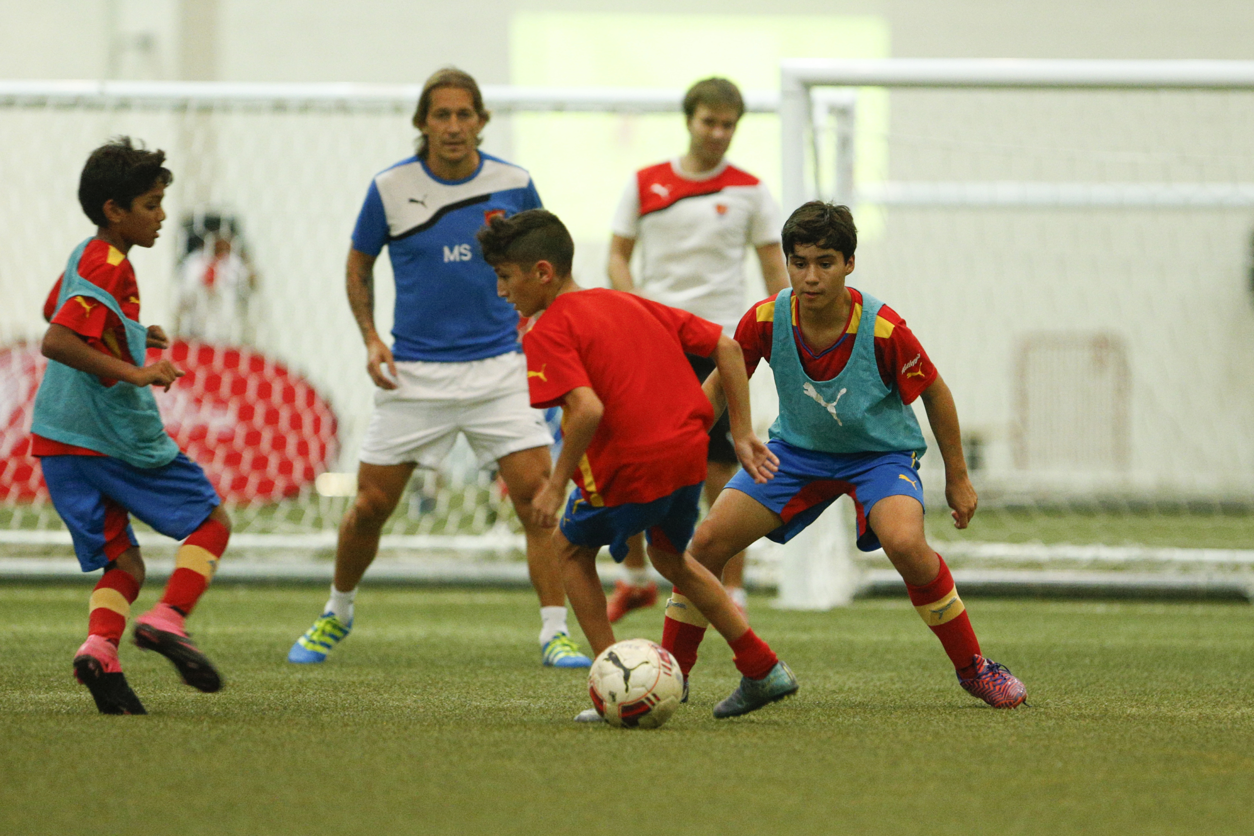 A coaching session on a UAE pitch