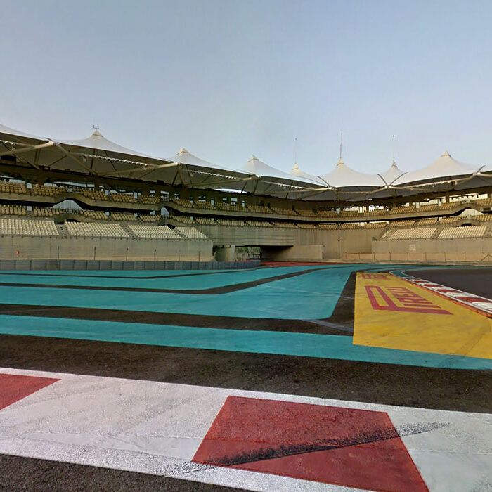 Cars on track seen from the West Grandstand at Yas Marina Circuit