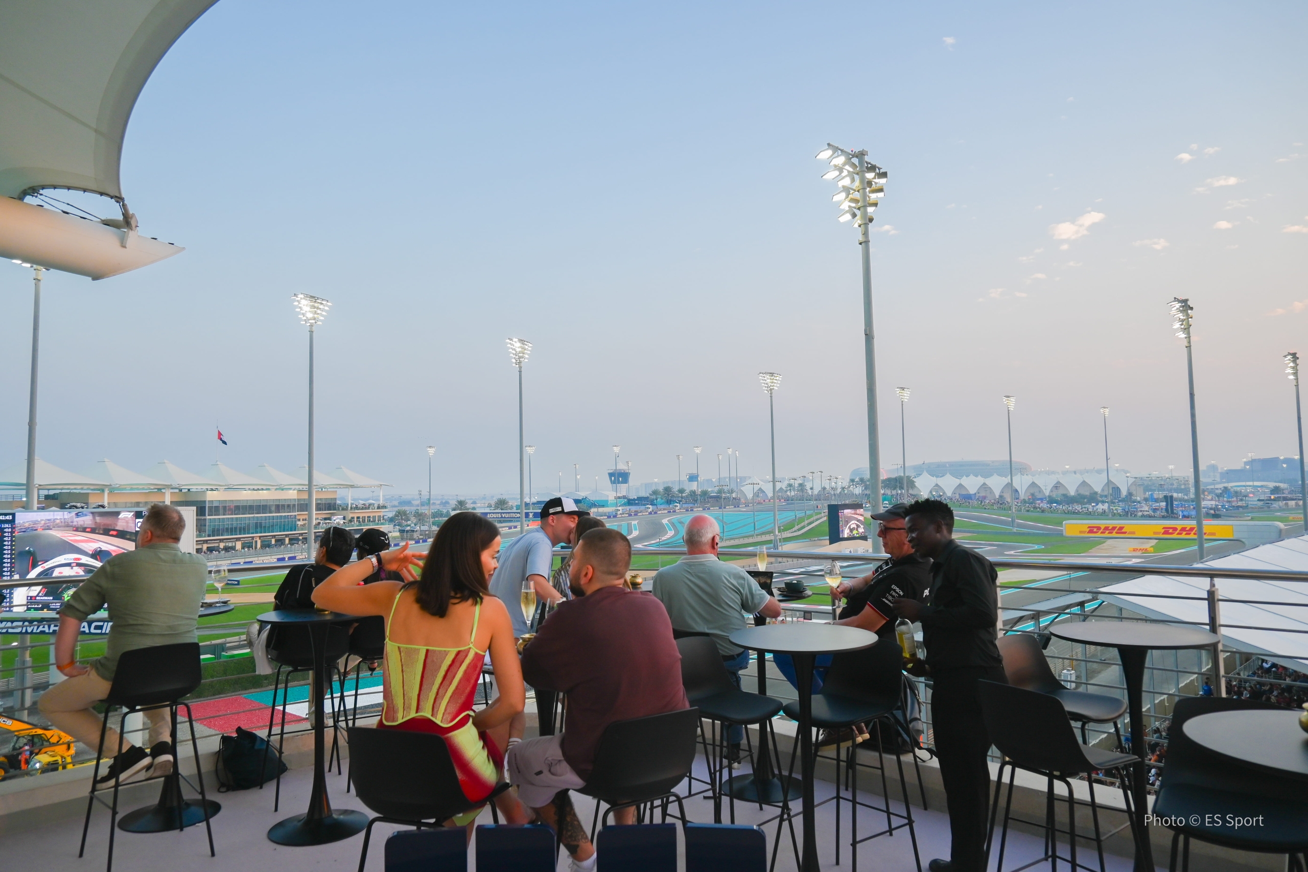Guests watching the race from the suite balcony