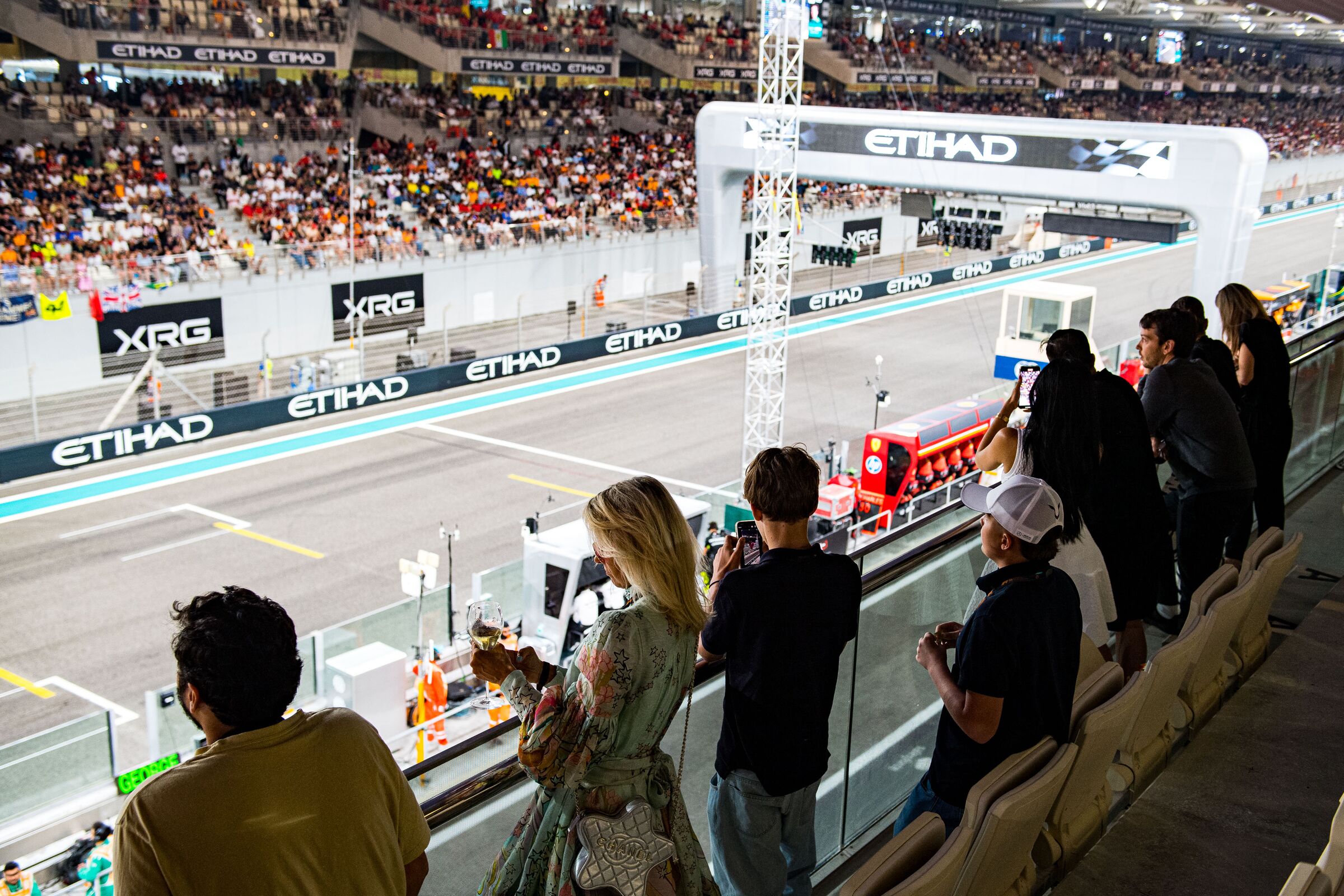 Guests on a hospitality balcony over the pit straight at Yas Marina Circuit