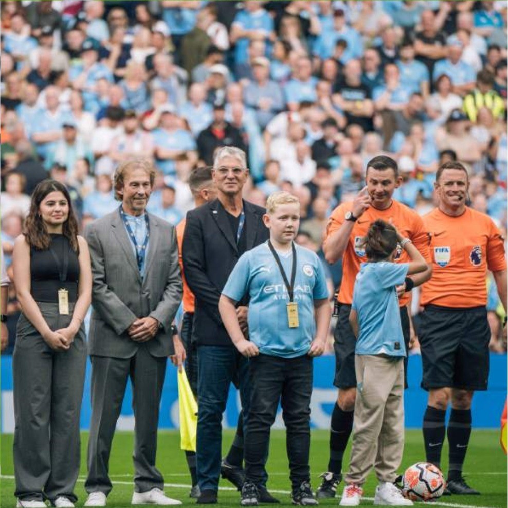 ES Sport guests on the pitch with the match officials before kick off at the Etihad Stadium