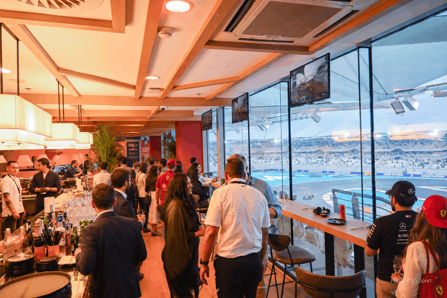 Guests on the Shams Suite balcony at Yas Marina Circuit